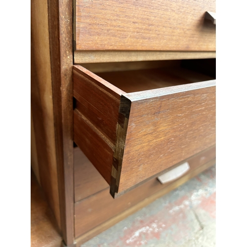 139 - A mid 20th century Stag teak sideboard with three cupboard doors and four central drawers - approx. ... 