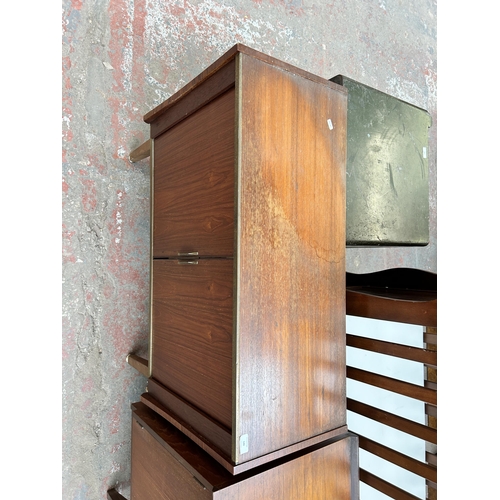 140 - A mid 20th century teak tambour door media cabinet