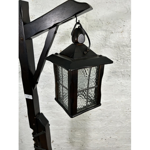 142 - A beech hanging lantern standard lamp - approx. 151cm high