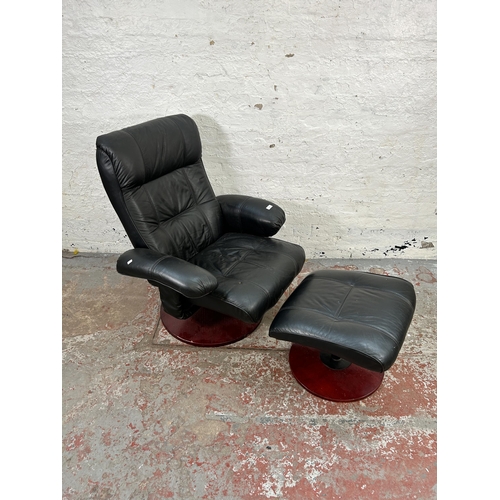 154 - A Stressless style black leather swivel reclining armchair and stool