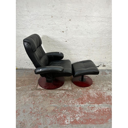 154 - A Stressless style black leather swivel reclining armchair and stool