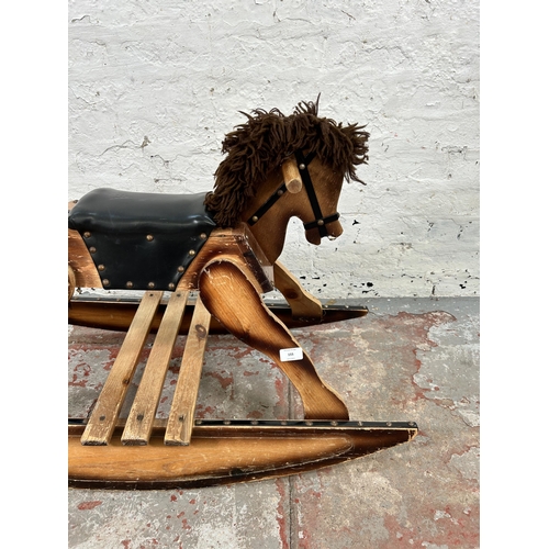 155 - A pine and black vinyl child's rocking horse