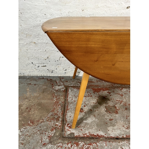 156 - An Ercol Windsor blonde elm and beech drop leaf oval dining table - approx. 73cm high x 113cm wide x... 