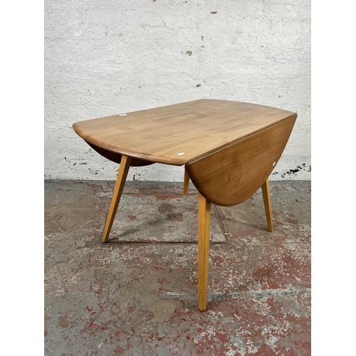 156 - An Ercol Windsor blonde elm and beech drop leaf oval dining table - approx. 73cm high x 113cm wide x... 