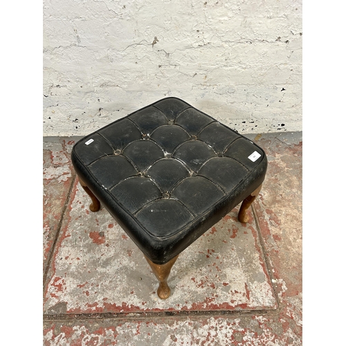 165 - A mid 20th century Miss Muffet black vinyl and beech footstool