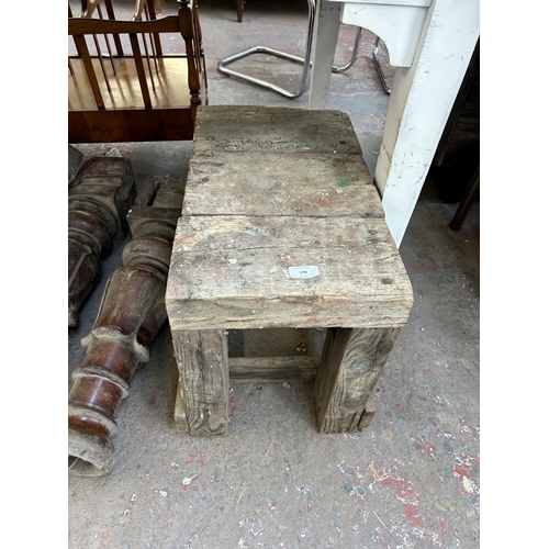 170 - Five items, three Victorian mahogany dining table legs and two early 20th century pine saw benches