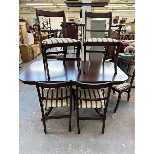 171 - A Regency style mahogany extending dining table and six chairs