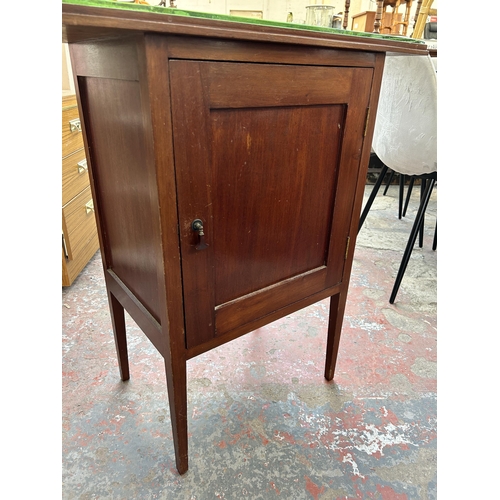 172 - An early 20th century mahogany bedside cabinet with later added glass top