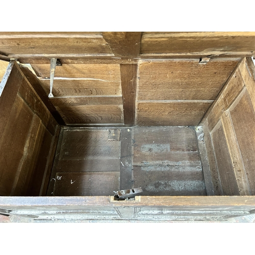 173 - A Georgian oak four panel blanket box - approx. 68cm high x 110cm wide x 65cm deep