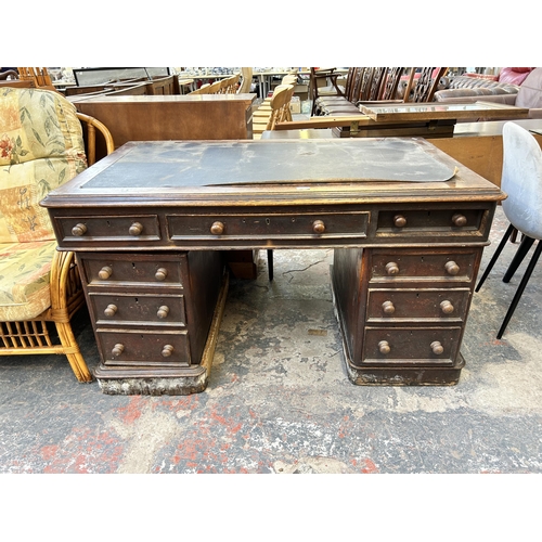 177 - A Victorian oak pedestal desk with black writing surface