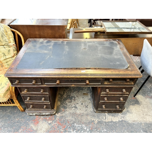 177 - A Victorian oak pedestal desk with black writing surface