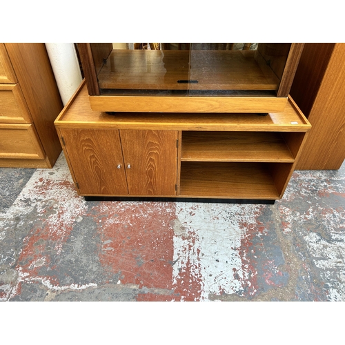 180 - Two mid 20th century teak media cabinets