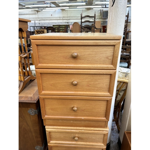 181 - A pair of 1980s G Plan teak bedside chests of three drawers