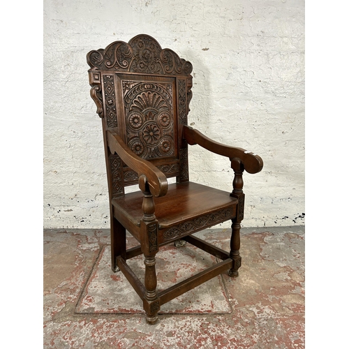 186 - A 17th century style carved oak Wainscot chair - approx. 126cm high x 58cm wide x 46cm deep