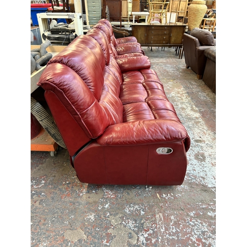 188 - A modern red leather reclining three piece lounge suite comprising three seater sofa and two armchai... 