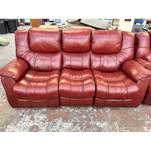 188 - A modern red leather reclining three piece lounge suite comprising three seater sofa and two armchai... 