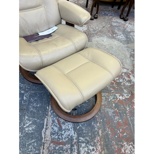 194 - A HSL Hamilton Grande Hudson Latte leather and walnut swivel reclining armchair and stool - RRP £840