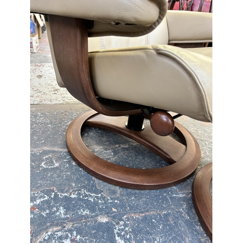 194 - A HSL Hamilton Grande Hudson Latte leather and walnut swivel reclining armchair and stool - RRP £840