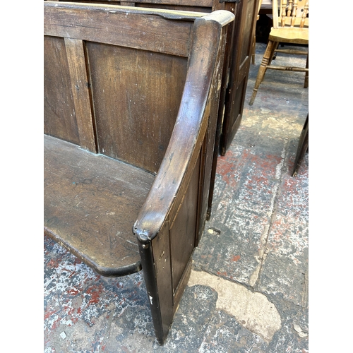 197 - An early 20th century pine curved church pew - approx. 85cm high x 170cm wide x 49cm deep