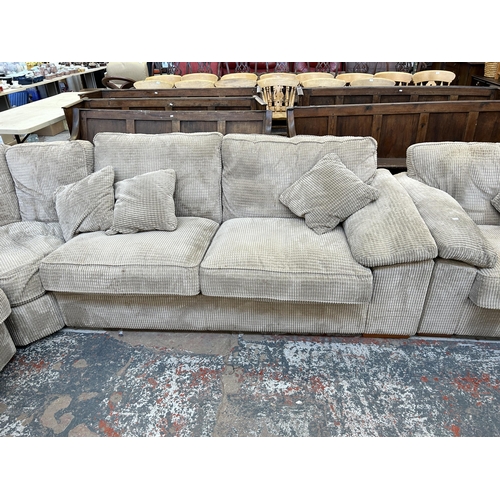 199A - A modern grey fabric two piece lounge suite comprising L shaped corner sofa and armchair