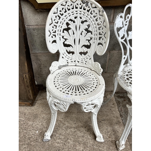 20 - Two Victorian style white painted cast alloy patio chairs