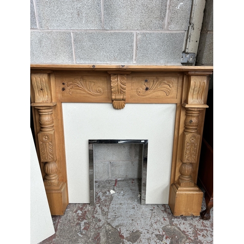 26 - A Victorian style carved pine and marble fire surround - approx. 122cm high x 150cm wide