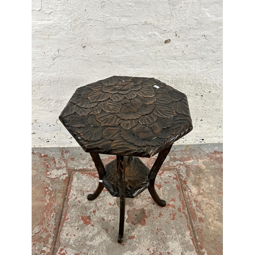 28 - A Liberty's of London hand carved octagonal two tier side table, circa 1905 - approx. 72cm high x 45... 