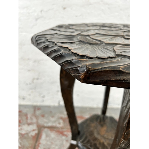 28 - A Liberty's of London hand carved octagonal two tier side table, circa 1905 - approx. 72cm high x 45... 