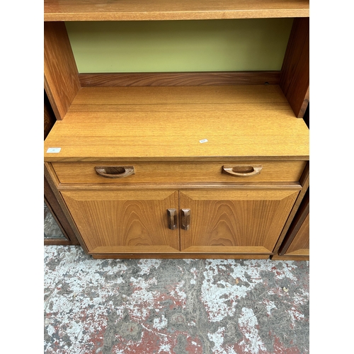 30 - A 1970s G Plan teak bookcase with single drawer and two lower cupboard doors - approx. 200cm high x ... 