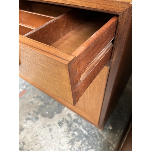 32 - A 1970s G Plan teak bookcase with two upper glazed doors, single drawer and two lower cupboard doors... 