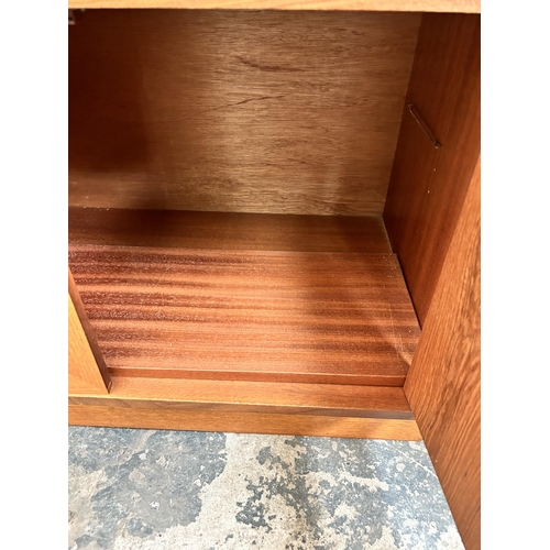 32 - A 1970s G Plan teak bookcase with two upper glazed doors, single drawer and two lower cupboard doors... 