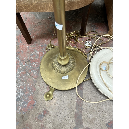 38 - Two standard lamps, one brass tri-footed and one white painted barley twist