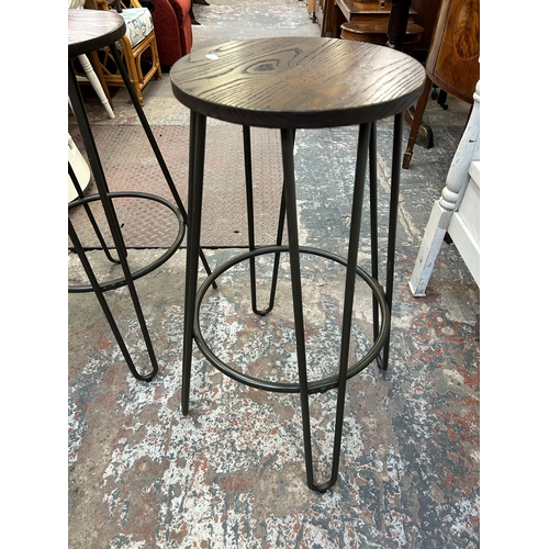 42 - A pair of industrial style oak and grey metal kitchen bar stools - approx. 75cm high x 33cm diameter