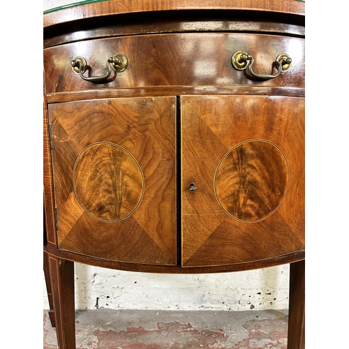 44 - An early 20th century Regency style inlaid mahogany bow fronted sideboard with two outer cupboard do... 