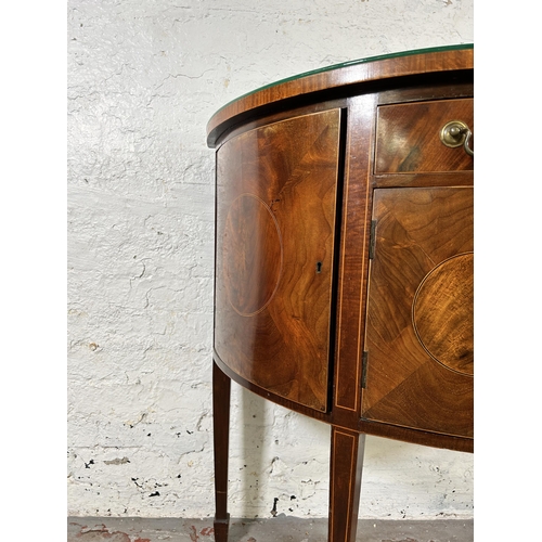 44 - An early 20th century Regency style inlaid mahogany bow fronted sideboard with two outer cupboard do... 