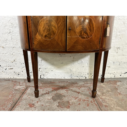 44 - An early 20th century Regency style inlaid mahogany bow fronted sideboard with two outer cupboard do... 