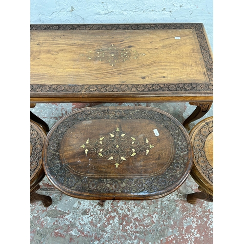 45B - Four Indian carved hardwood and brass inlaid occasional tables