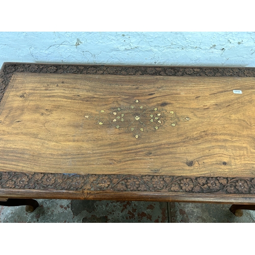 45B - Four Indian carved hardwood and brass inlaid occasional tables