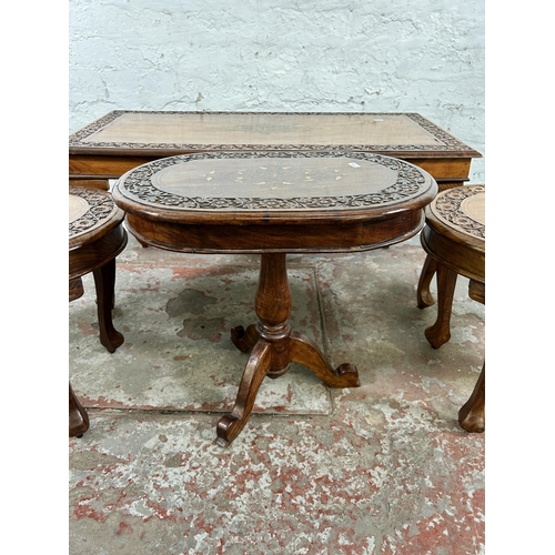 45B - Four Indian carved hardwood and brass inlaid occasional tables