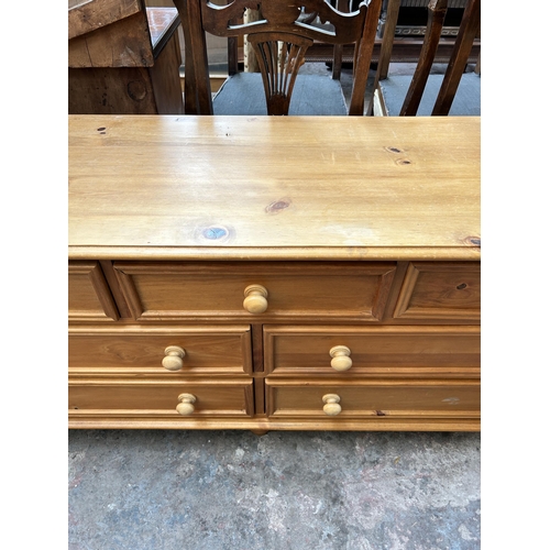 5 - A pine chest of three short over four long drawers - approx. 73cm high x 152cm wide x 46cm deep