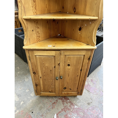 52A - A pine free standing corner cabinet - approx. 197cm high