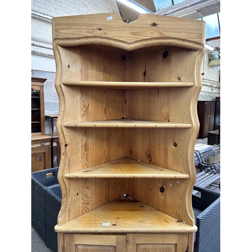 52A - A pine free standing corner cabinet - approx. 197cm high