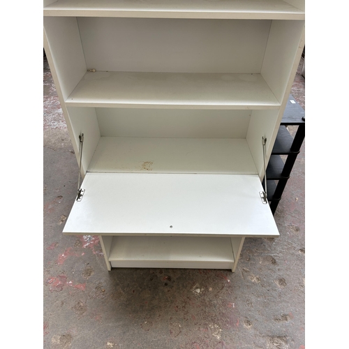 53 - A white laminate five tier bookcase with fall front