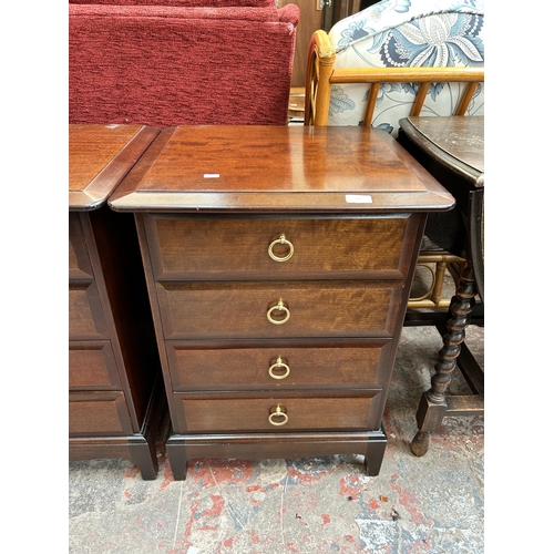 65 - A pair of Stag Minstrel mahogany bedside chests of four drawers