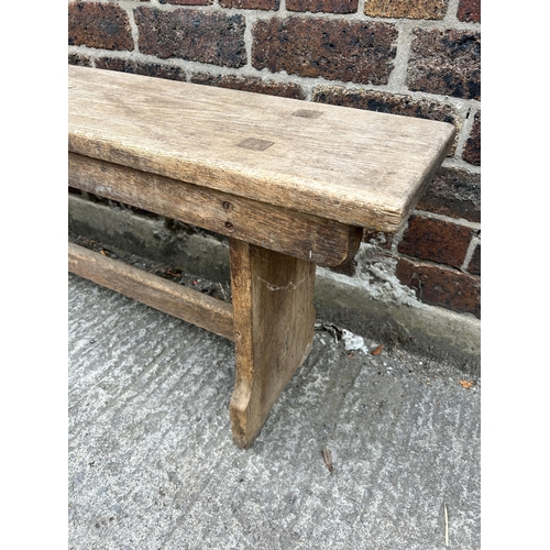 79 - An early 20th century oak bench - approx. 48cm high x 25cm wide x 244cm long