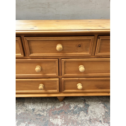 8 - A pine chest of three short over four long drawers - approx. 73cm high x 153cm wide x 46cm deep