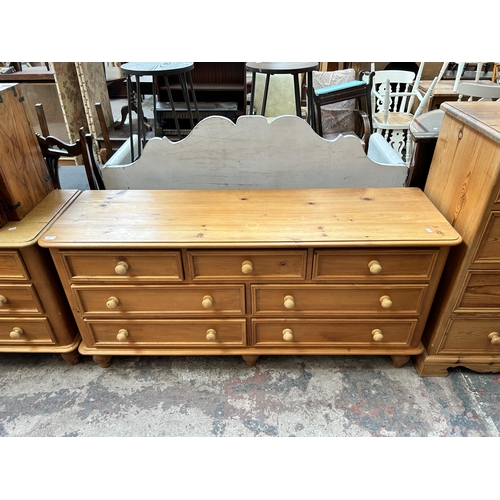 8 - A pine chest of three short over four long drawers - approx. 73cm high x 153cm wide x 46cm deep