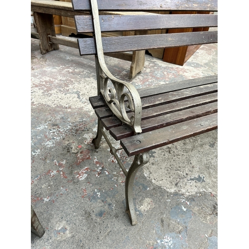 80 - A cast iron and wooden slatted garden bench