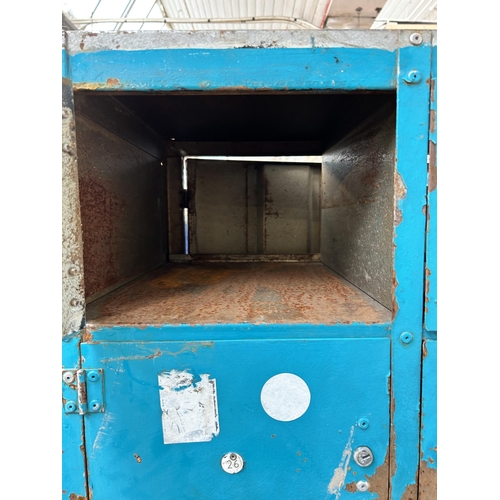 87A - A painted metal industrial locker cabinet - approx. 181cm high x 90cm wide x 46cm deep