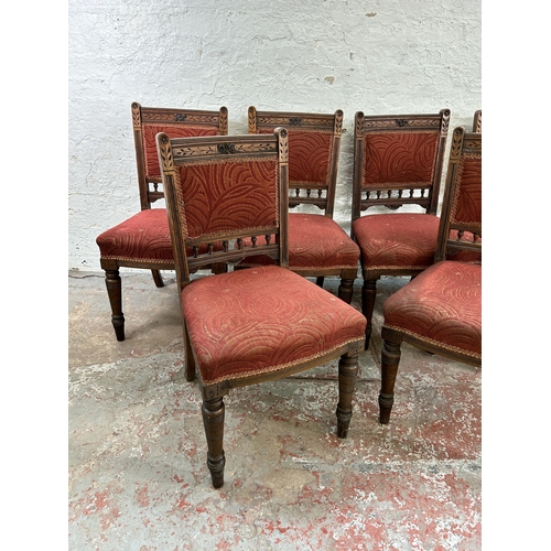 94 - Six late Victorian carved oak and red fabric upholstered dining chairs